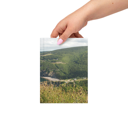 Hand holding the Nova Scotia coastal photography hardcover journal for scale